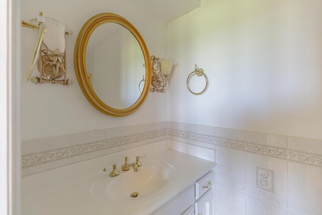 7900 Ooltewah Georgetown Rd, Ooltewah, TN 37363 - bathroom with vanity, tile walls, and a wainscoted wall