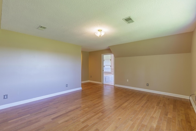 7900 Ooltewah Georgetown Rd, Ooltewah, TN 37363 - spare room featuring light wood-style flooring, a textured ceiling, and baseboards