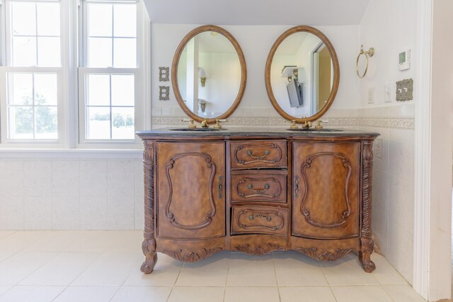 7900 Ooltewah Georgetown Rd, Ooltewah, TN 37363 - full bathroom with double vanity, tile walls, wainscoting, and tile patterned flooring