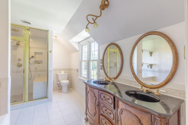 7900 Ooltewah Georgetown Rd, Ooltewah, TN 37363 - full bath featuring tile walls, vaulted ceiling, double vanity, toilet, and a stall shower