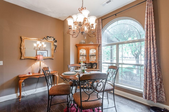 169 Southern Dr, Ringgold, GA 30736 - dining space with a chandelier, baseboards, and wood finished floors