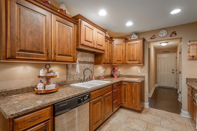 169 Southern Dr, Ringgold, GA 30736 - kitchen featuring a sink, stainless steel dishwasher, brown cabinets, light tile patterned floors, and recessed lighting