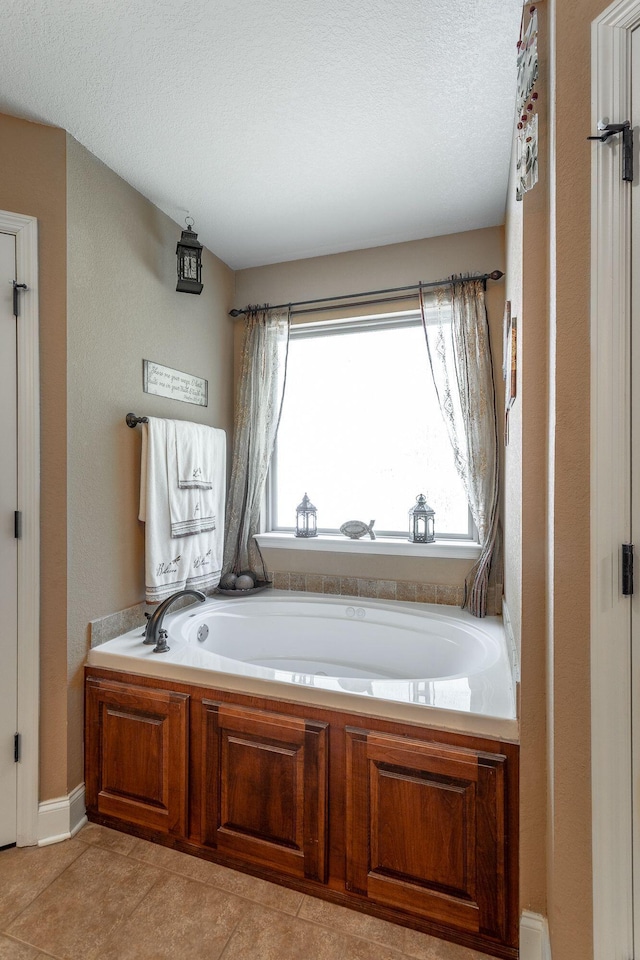 169 Southern Dr, Ringgold, GA 30736 - bathroom with a bath, a textured ceiling, and tile patterned flooring