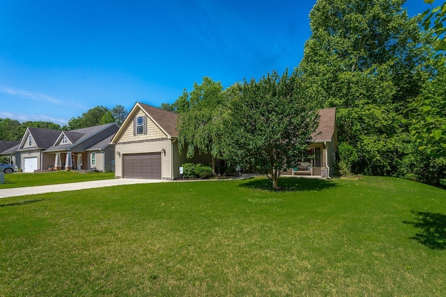 169 Southern Dr, Ringgold, GA 30736 - view of front of property featuring a front lawn, a garage, concrete driveway, and covered porch