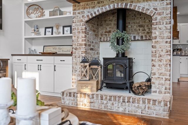 229 Blue Bird Way, Dunlap, TN 37327 - living area featuring a wood stove and wood finished floors