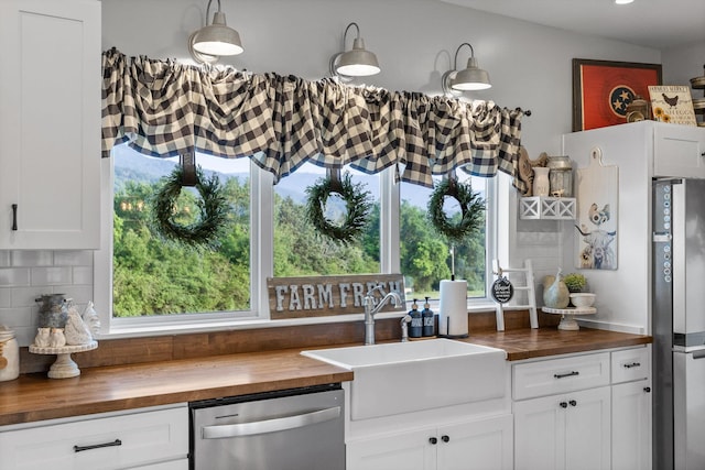 229 Blue Bird Way, Dunlap, TN 37327 - kitchen featuring butcher block countertops, stainless steel appliances, a sink, and plenty of natural light