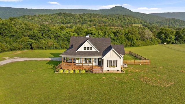 229 Blue Bird Way, Dunlap, TN 37327 - rear view of house with board and batten siding, a wooded view, covered porch, crawl space, and a chimney