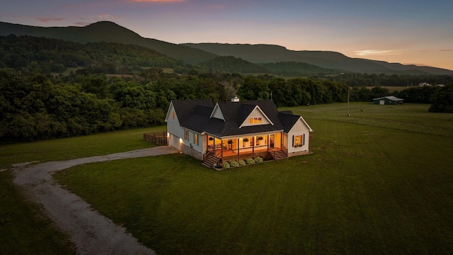 229 Blue Bird Way, Dunlap, TN 37327 - view of front of property with dirt driveway, a front yard, a mountain view, covered porch, and a chimney