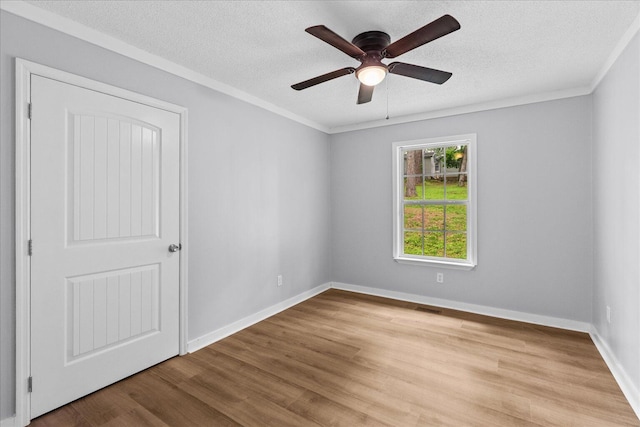 724 Shelly Ln, Rossville, GA 30741 - empty room featuring a ceiling fan, light wood-style flooring, a textured ceiling, baseboards, and ornamental molding