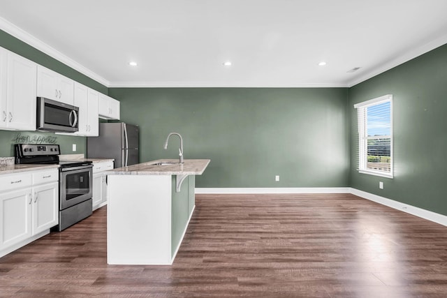 603 Browns Ferry Rd, Chattanooga, TN 37419 - kitchen featuring stainless steel appliances, a sink, ornamental molding, white cabinets, and a kitchen island with sink