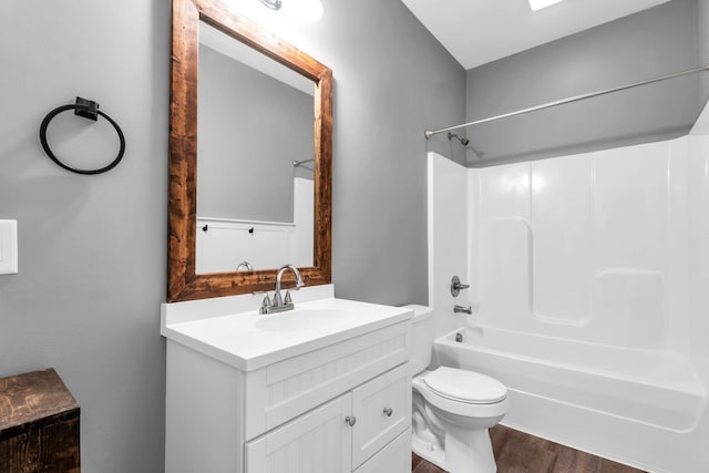 603 Browns Ferry Rd, Chattanooga, TN 37419 - bathroom with vanity, toilet, bathtub / shower combination, and wood finished floors