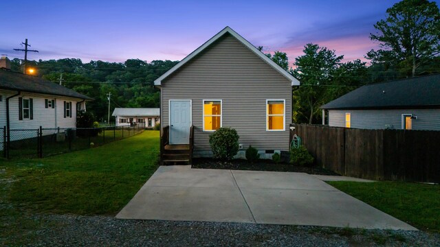 603 Browns Ferry Rd, Chattanooga, TN 37419 - back of property at dusk featuring a patio and crawl space