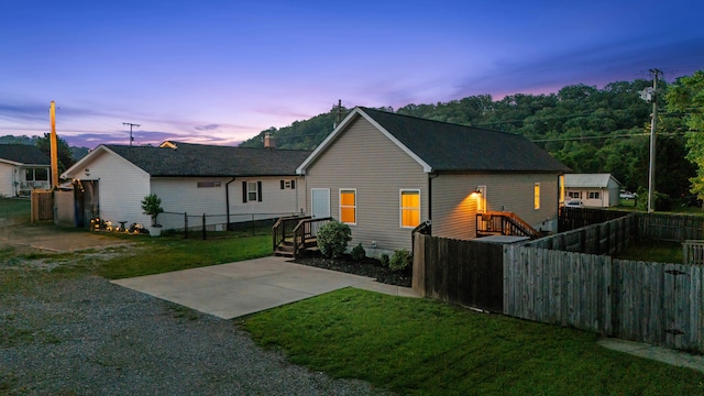 603 Browns Ferry Rd, Chattanooga, TN 37419 - back of house at dusk featuring a patio