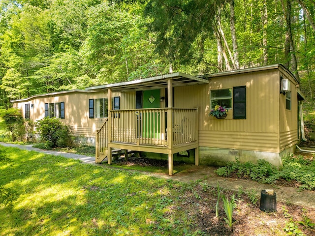 5203 Howardsville Rd, Apison, TN 37302 - manufactured / mobile home with a front yard and a deck