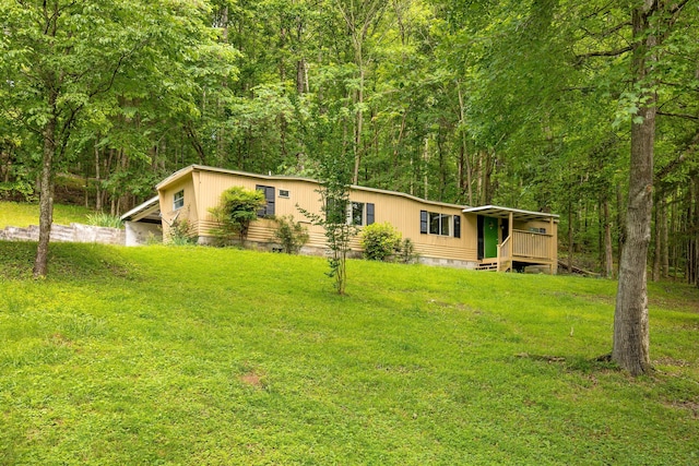 5203 Howardsville Rd, Apison, TN 37302 - view of front of property with crawl space, a front lawn, and a forest view