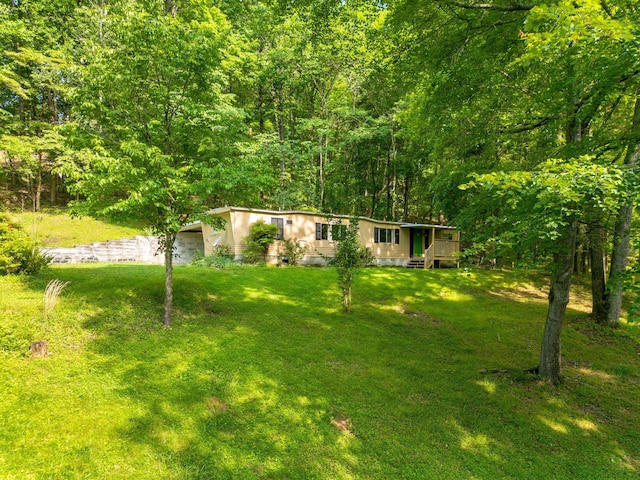 5203 Howardsville Rd, Apison, TN 37302 - view of front facade featuring a front yard and a forest view