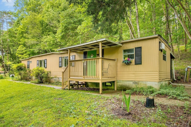 5203 Howardsville Rd, Apison, TN 37302 - view of front of house featuring a front lawn and a wooden deck