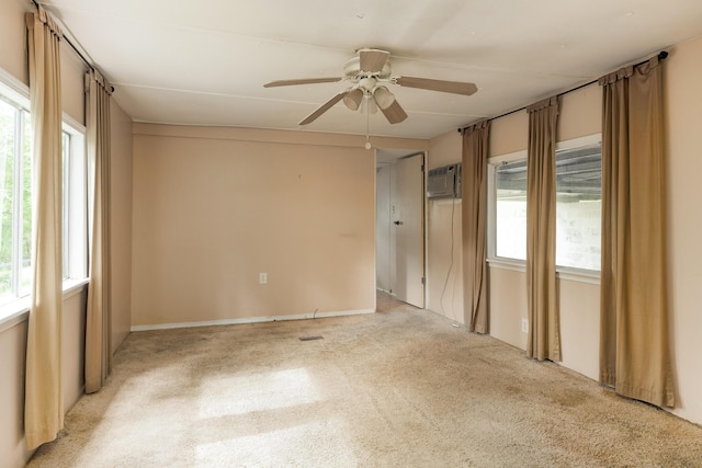 5203 Howardsville Rd, Apison, TN 37302 - empty room featuring light colored carpet, ceiling fan, and a wall mounted air conditioner