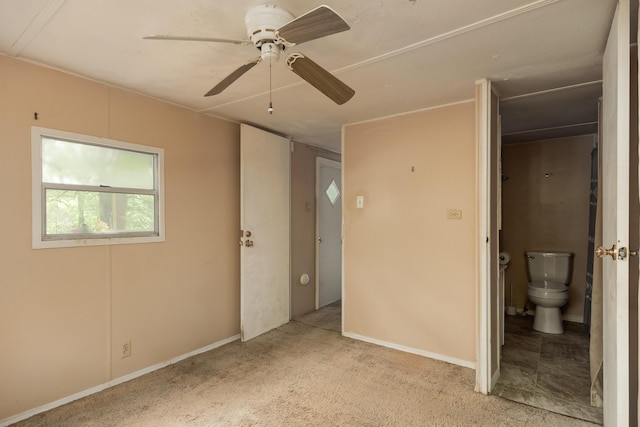 5203 Howardsville Rd, Apison, TN 37302 - unfurnished bedroom with carpet flooring, ensuite bathroom, and a ceiling fan