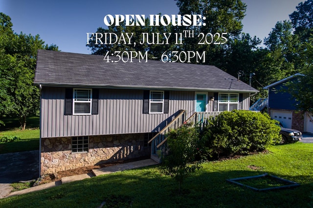 7115 Elmbrook Ln, Harrison, TN 37341 - view of front of house with stone siding, a front lawn, and board and batten siding