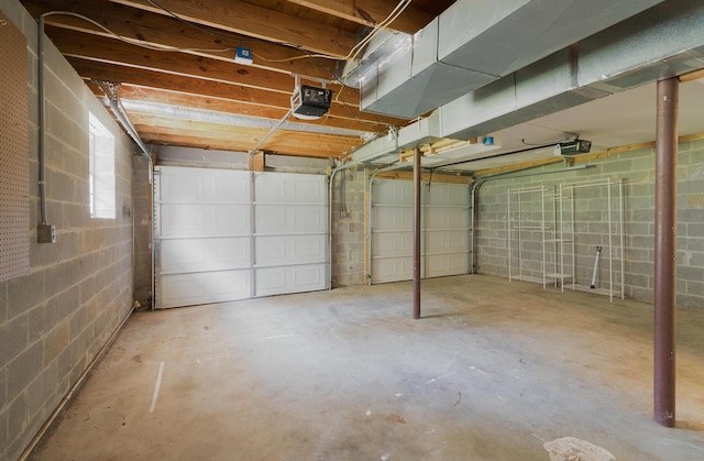 7115 Elmbrook Ln, Harrison, TN 37341 - garage with a garage door opener and concrete block wall