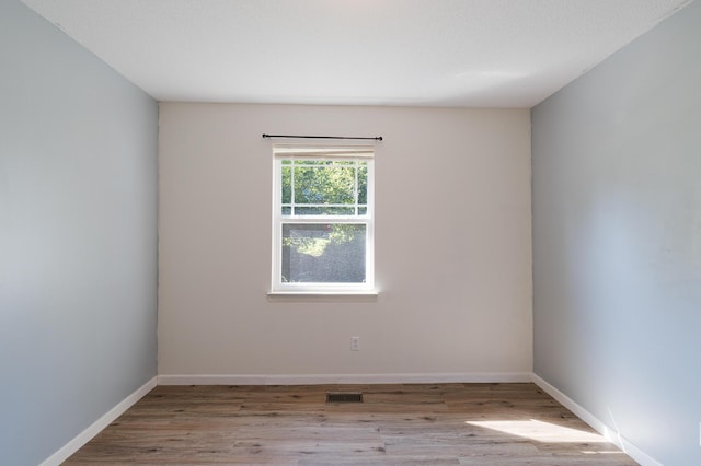 7115 Elmbrook Ln, Harrison, TN 37341 - unfurnished room featuring wood finished floors and baseboards