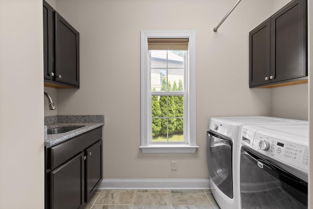 2904 Reflection Ln, Ooltewah, TN 37363 - laundry area with cabinet space, washing machine and clothes dryer, and baseboards