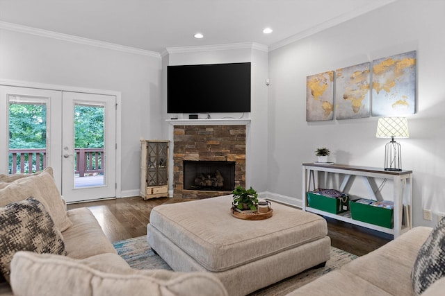2904 Reflection Ln, Ooltewah, TN 37363 - living area featuring wood finished floors, ornamental molding, baseboards, a stone fireplace, and recessed lighting