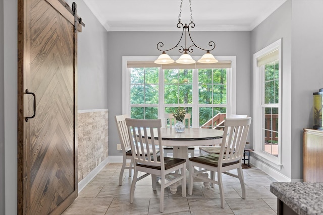 2904 Reflection Ln, Ooltewah, TN 37363 - dining room with a barn door, baseboards, and crown molding