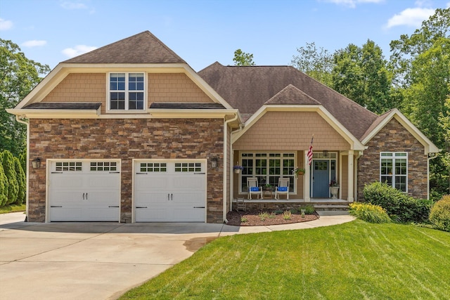2904 Reflection Ln, Ooltewah, TN 37363 - craftsman-style house featuring stone siding, driveway, a front yard, covered porch, and roof with shingles