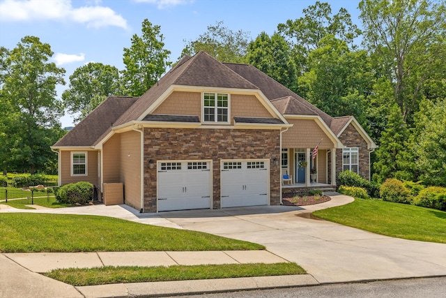 2904 Reflection Ln, Ooltewah, TN 37363 - craftsman-style house featuring stone siding, driveway, a porch, and roof with shingles