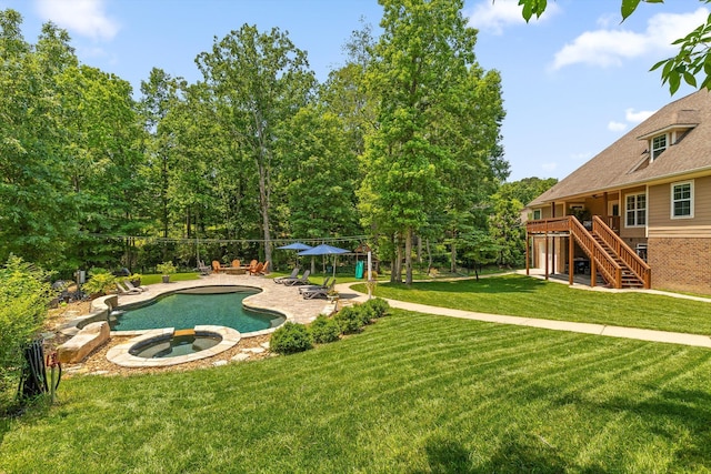 2904 Reflection Ln, Ooltewah, TN 37363 - view of swimming pool featuring stairway, a patio, a lawn, and a pool with connected hot tub
