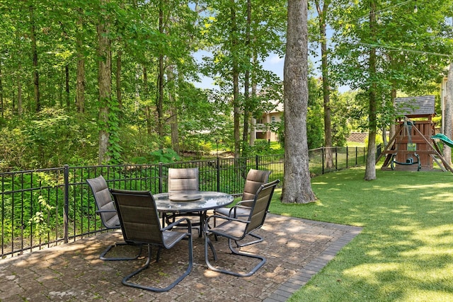 2904 Reflection Ln, Ooltewah, TN 37363 - view of patio featuring outdoor dining space and a playground