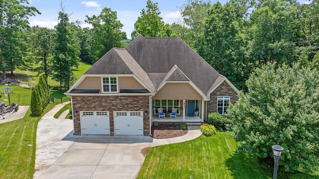 2904 Reflection Ln, Ooltewah, TN 37363 - view of front of house featuring concrete driveway, covered porch, and a front lawn