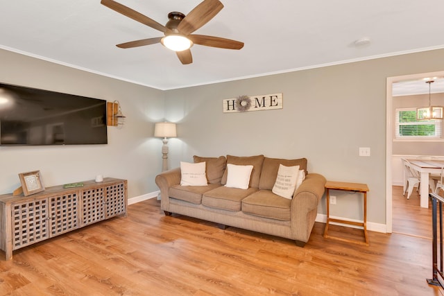 1415 Caramel Cir, Hixson, TN 37343 - living room featuring ceiling fan, wood finished floors, ornamental molding, and baseboards