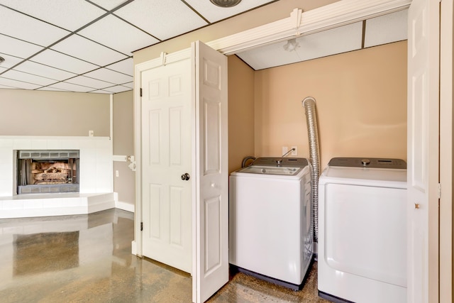 1415 Caramel Cir, Hixson, TN 37343 - laundry area with independent washer and dryer and a tiled fireplace