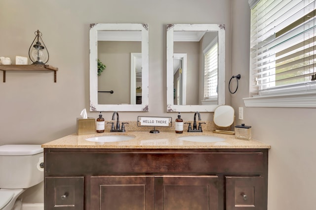 1415 Caramel Cir, Hixson, TN 37343 - bathroom with double vanity, toilet, and crown molding
