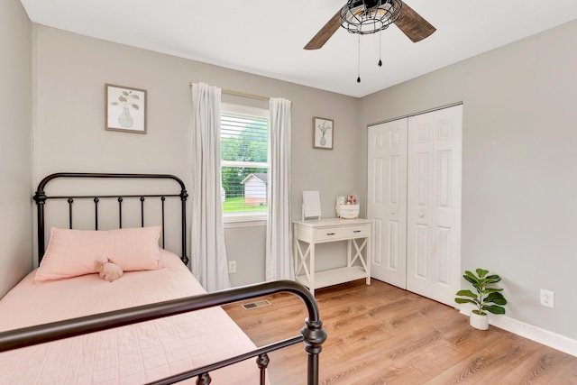 1415 Caramel Cir, Hixson, TN 37343 - bedroom with light wood-style flooring, a closet, baseboards, and a ceiling fan