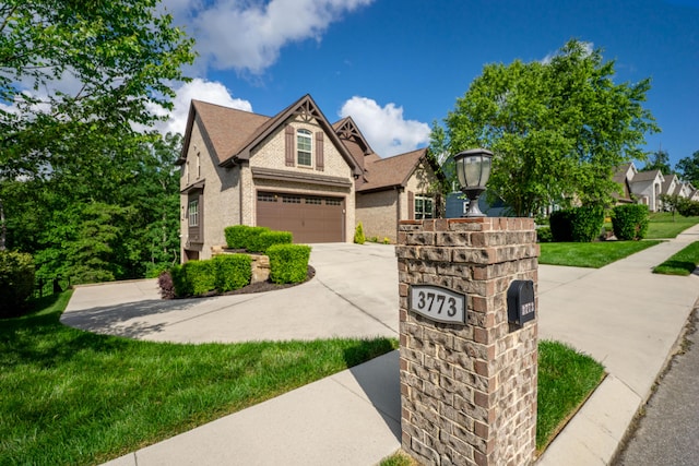 3773 Lacy Leaf Ln, Apison, TN 37302 - view of front of house featuring concrete driveway, a garage, and a front yard