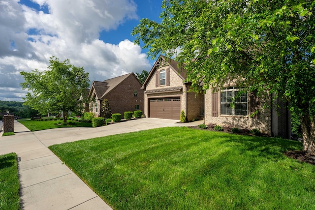 3773 Lacy Leaf Ln, Apison, TN 37302 - view of front of home featuring brick siding, concrete driveway, and a front lawn