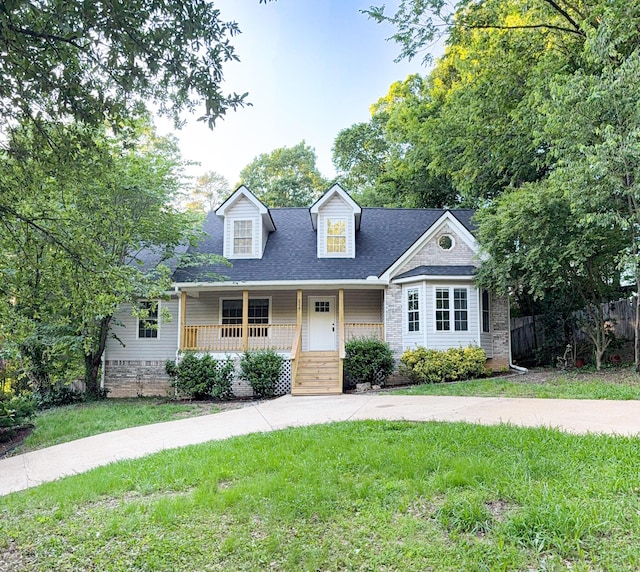 6527 Shallowmar Ln, Hixson, TN 37343 - cape cod house featuring covered porch and a shingled roof