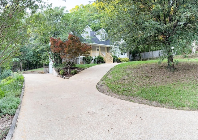 6527 Shallowmar Ln, Hixson, TN 37343 - view of front of home featuring concrete driveway, a porch, and stairs