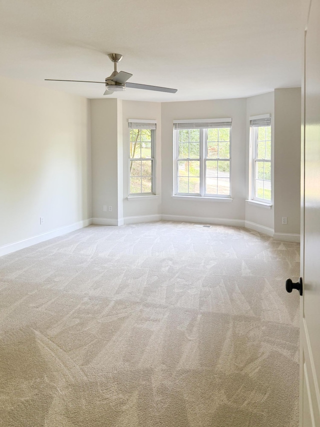 6527 Shallowmar Ln, Hixson, TN 37343 - unfurnished room featuring healthy amount of natural light, light colored carpet, and baseboards