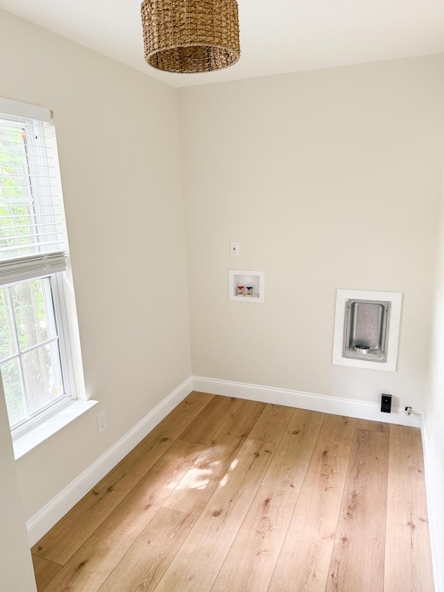 6527 Shallowmar Ln, Hixson, TN 37343 - laundry room with hookup for a washing machine, light wood-style flooring, and baseboards