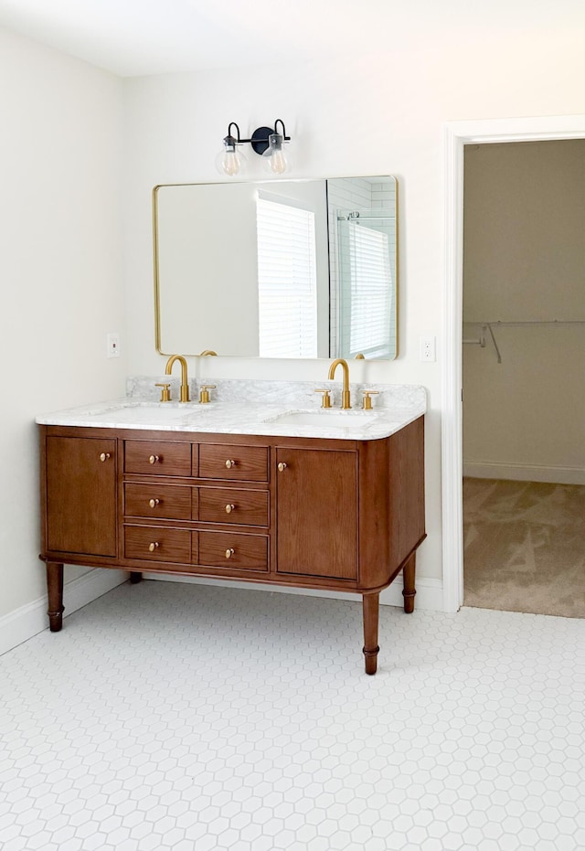 6527 Shallowmar Ln, Hixson, TN 37343 - bathroom with double vanity, baseboards, and a spacious closet