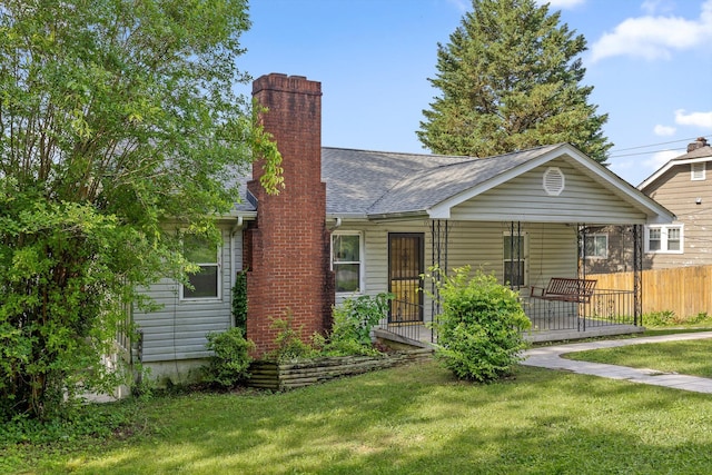 306 Pine Ridge Rd, Chattanooga, TN 37405 - view of front facade with a chimney, roof with shingles, and a porch