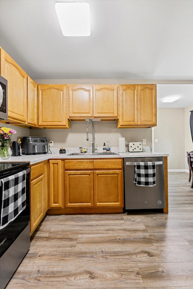 334 Kay Conley Rd, Rock Spring, GA 30739 - kitchen with appliances with stainless steel finishes, a sink, light countertops, and light wood-style floors