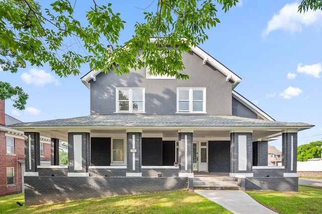 2000 Oak St, Chattanooga, TN 37404 - view of front of house featuring covered porch, a front lawn, and brick siding