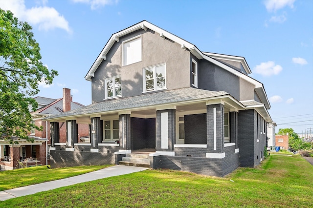 2000 Oak St, Chattanooga, TN 37404 - view of front of property featuring a porch, a front lawn, brick siding, and stucco siding