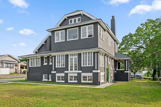 2000 Oak St, Chattanooga, TN 37404 - view of front of house featuring a front yard, a chimney, stucco siding, and a shingled roof
